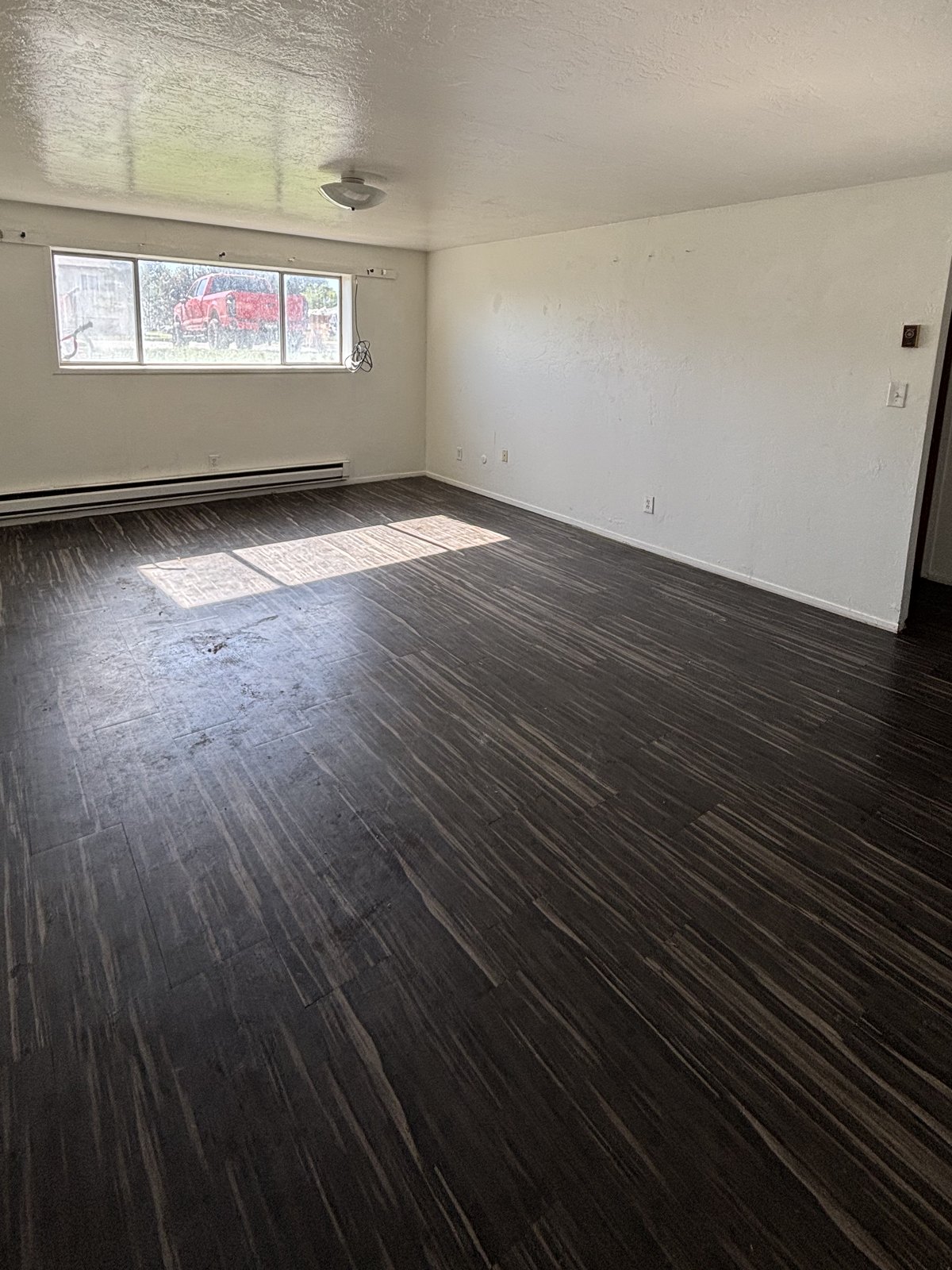 Living room after Peak Property Cleanouts — emptied and swept clean
