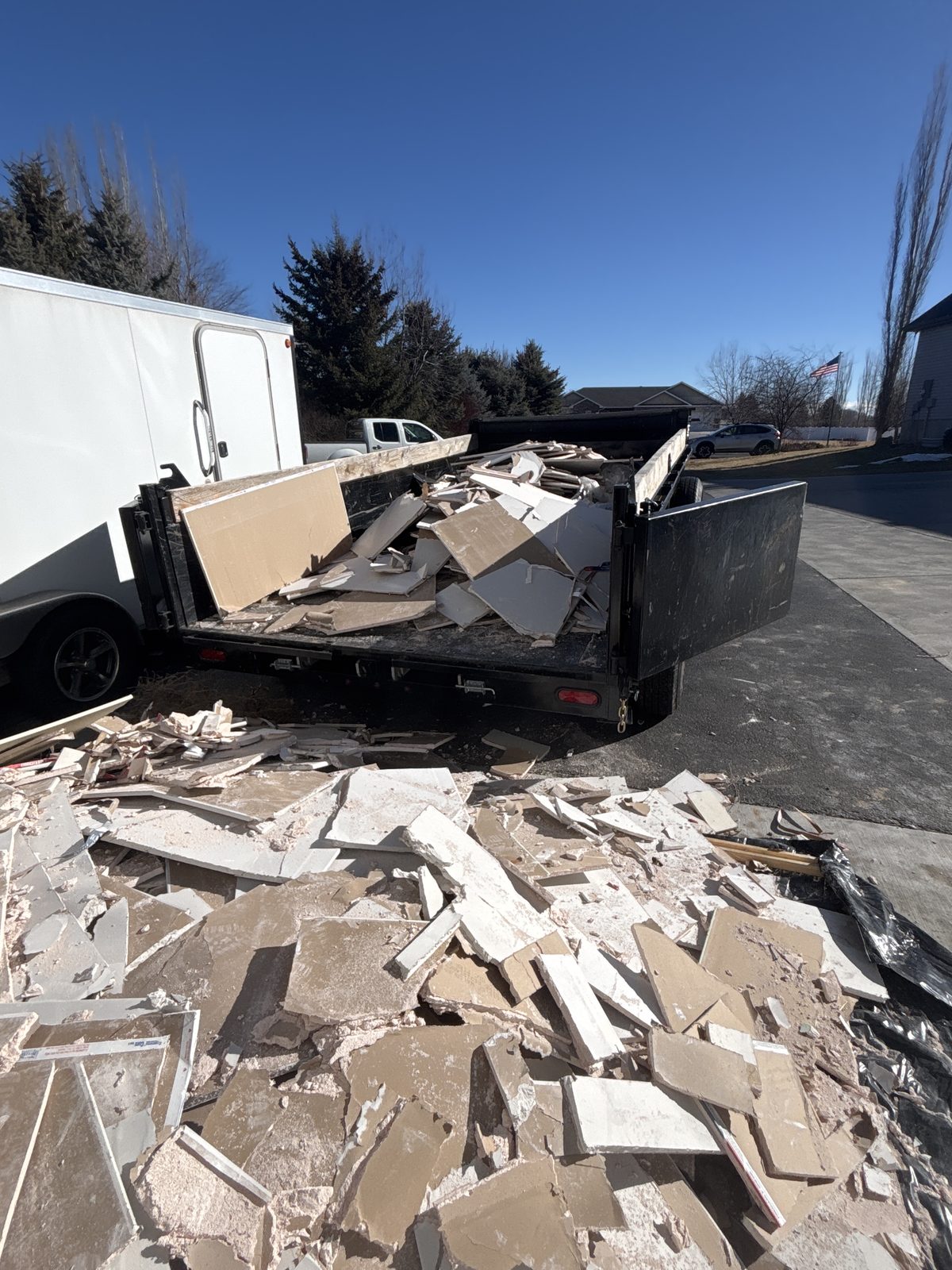 Peak Property Cleanouts loaded trailer hauling junk in East Idaho