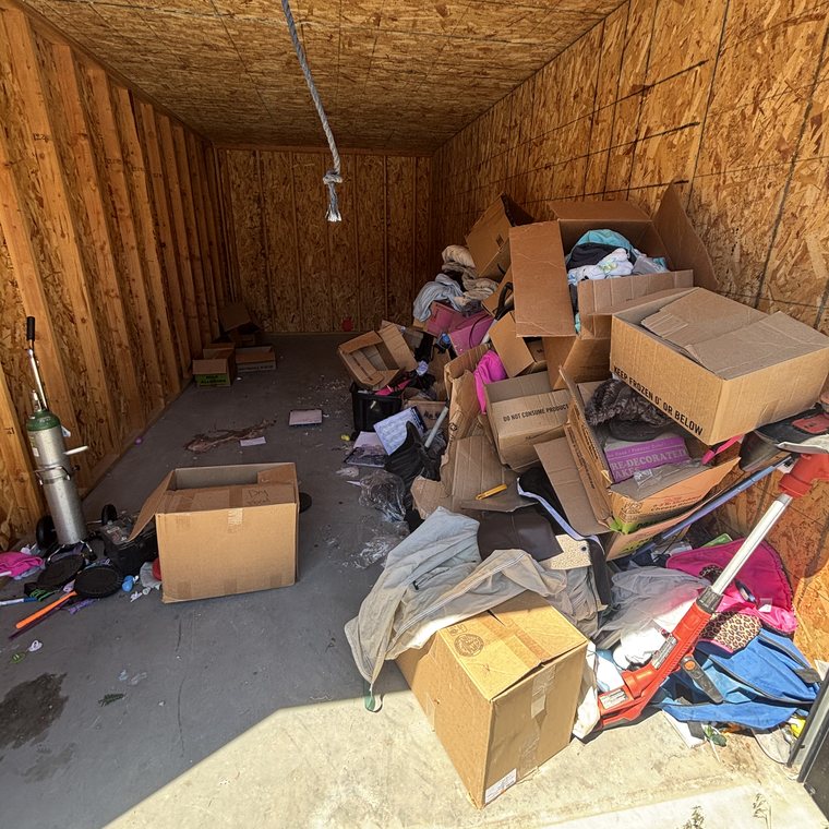 Garage cleanout before — packed with junk