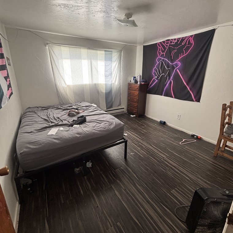 Bedroom cleanout before — furnished and cluttered